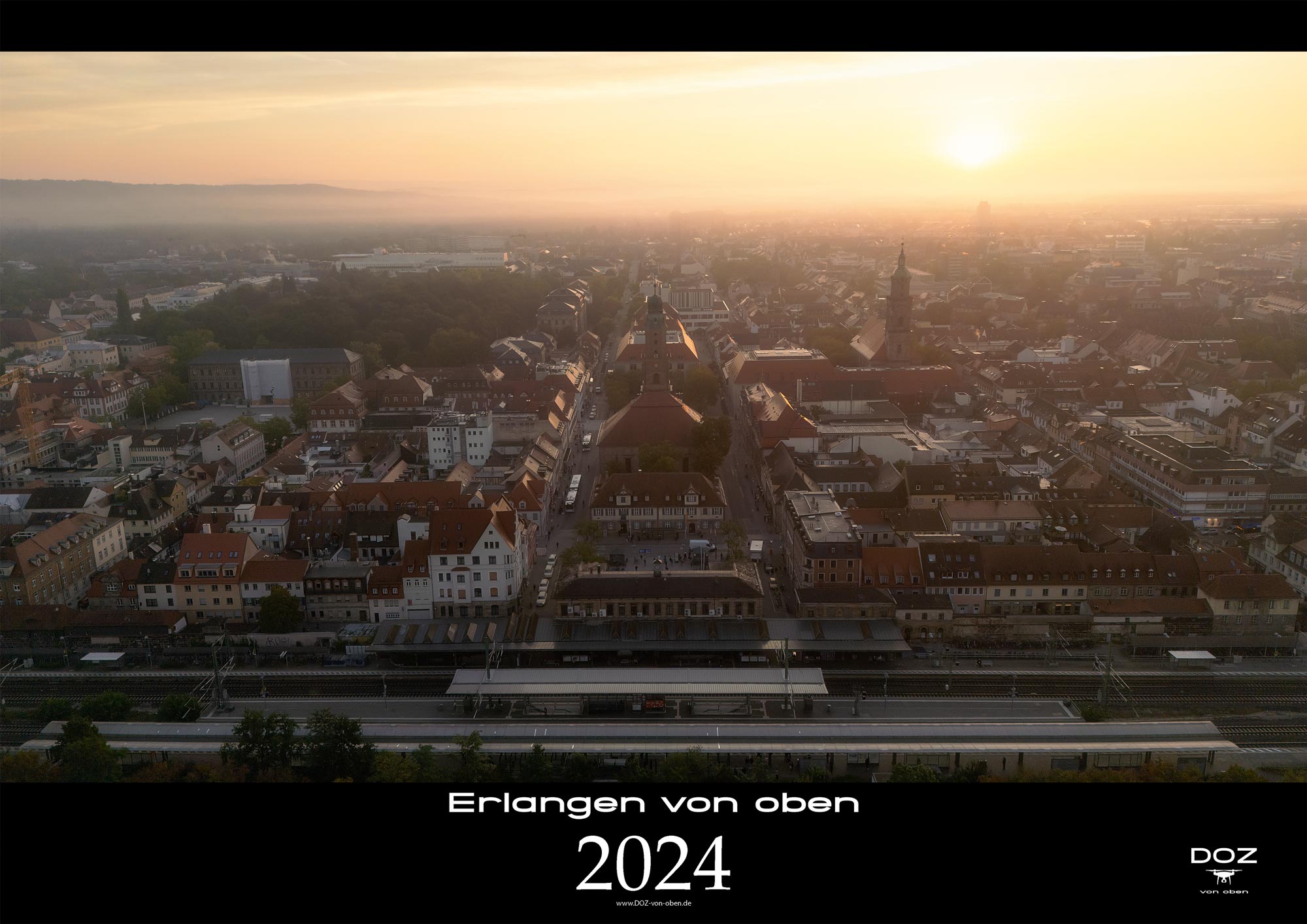 Kalenderbild-Erlangen-von-oben-2024-Bahnhof-Erlangen_Morgendaämmerung